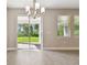 An open doorway to a outdoor space, in a home with gorgeous tile floors at 620 Nasturtium Ct, Nokomis, FL 34275