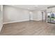 A spacious living room with modern tile floors at 620 Nasturtium Ct, Nokomis, FL 34275