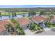 Stunning aerial shot of a home near a pond and golf course at 6408 Rookery Cir, Bradenton, FL 34203
