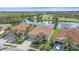 Beautiful aerial view of a home with well-maintained landscaping, near the water at 6408 Rookery Cir, Bradenton, FL 34203