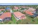 Beautiful aerial view of homes in a lush, planned community surrounding a pond at 6408 Rookery Cir, Bradenton, FL 34203