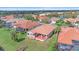 Beautiful aerial view of a single-Gathering home with a red-tiled roof and screened in lanai at 6408 Rookery Cir, Bradenton, FL 34203