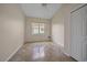 Neutral bedroom featuring tile floors, recessed lighting, and a window view at 6408 Rookery Cir, Bradenton, FL 34203