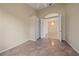 This bedroom features tile flooring, high ceilings, and an open doorway to an adjacent room at 6408 Rookery Cir, Bradenton, FL 34203