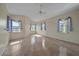 Spacious bedroom with tile flooring, ceiling fan, and multiple windows offering bright, natural light at 6408 Rookery Cir, Bradenton, FL 34203