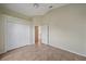 Bedroom featuring tile floors, a closet and an open doorway to another room at 6408 Rookery Cir, Bradenton, FL 34203