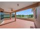 Spacious covered patio offers a serene view of the pond and golf course at 6408 Rookery Cir, Bradenton, FL 34203