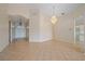 Spacious foyer with tiled floors and a stylish chandelier at 6408 Rookery Cir, Bradenton, FL 34203