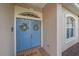 Elegant double front door adorned with floral wreaths, creating a warm and inviting entrance at 6408 Rookery Cir, Bradenton, FL 34203