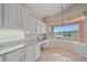 Kitchen nook featuring granite countertops and stunning lake views, perfect for enjoying meals at 6408 Rookery Cir, Bradenton, FL 34203