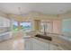 Kitchen nook featuring granite countertops and stunning lake views, perfect for enjoying meals at 6408 Rookery Cir, Bradenton, FL 34203