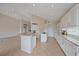 Bright kitchen with white cabinetry, granite counters, and an open layout at 6408 Rookery Cir, Bradenton, FL 34203