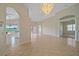 Open living space with tile flooring and golf course view at 6408 Rookery Cir, Bradenton, FL 34203