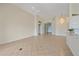 Living room featuring neutral walls and tile floors leading to the foyer at 6408 Rookery Cir, Bradenton, FL 34203