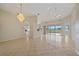 Bright living room with tiled floors and golf course views at 6408 Rookery Cir, Bradenton, FL 34203