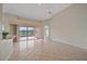 Bright living room with tile flooring and access to outdoor views at 6408 Rookery Cir, Bradenton, FL 34203