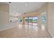 Living room featuring tile floors and open layout with golf course views at 6408 Rookery Cir, Bradenton, FL 34203