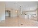 Bright, open living area featuring tiled floors, a chandelier, and access to other rooms at 6408 Rookery Cir, Bradenton, FL 34203