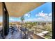 Balcony view with patio furniture, overlooking cityscape at 6415 Midnight Pass Rd # 710, Sarasota, FL 34242