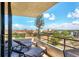 Balcony view with patio furniture overlooking city and waterway at 6415 Midnight Pass Rd # 710, Sarasota, FL 34242