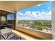 Balcony view of community, pond, and landscaping at 6415 Midnight Pass Rd # 710, Sarasota, FL 34242