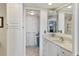 Bright bathroom with granite countertops and laundry area at 6415 Midnight Pass Rd # 710, Sarasota, FL 34242