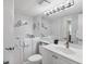 Modern bathroom features a walk-in tub and custom nautical decor at 6415 Midnight Pass Rd # 710, Sarasota, FL 34242