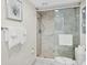 Updated bathroom with glass shower and modern fixtures at 6415 Midnight Pass Rd # 710, Sarasota, FL 34242