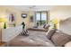 Bright bedroom with two beds and balcony access at 6415 Midnight Pass Rd # 710, Sarasota, FL 34242