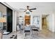 Dining area featuring a modern table set, kitchen views, and sliding door to balcony at 6415 Midnight Pass Rd # 710, Sarasota, FL 34242