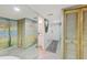 Hallway with mural, closet and mirror leads to other rooms at 6415 Midnight Pass Rd # 710, Sarasota, FL 34242