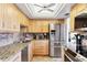 Charming kitchen boasting stainless steel appliances, granite counters, and ample cabinet space at 6415 Midnight Pass Rd # 710, Sarasota, FL 34242