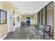 Well-maintained building lobby with bench seating, elevator access, and a view of outside at 6415 Midnight Pass Rd # 710, Sarasota, FL 34242