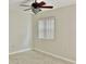 Bedroom featuring a ceiling fan and a window with blinds at 6430 Sun Eagle Ln # 203, Bradenton, FL 34210