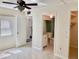 Open bedroom with tiled floors and view to bathroom and closet at 6430 Sun Eagle Ln # 203, Bradenton, FL 34210