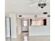 Inviting entryway with tile floors and view into updated kitchen and dining area at 6430 Sun Eagle Ln # 203, Bradenton, FL 34210