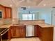 Well-equipped kitchen with granite countertops and stainless steel dishwasher at 6430 Sun Eagle Ln # 203, Bradenton, FL 34210