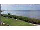 Scenic water view overlooking a lush green lawn and the beautiful ocean at 6430 Sun Eagle Ln # 203, Bradenton, FL 34210
