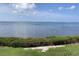 Scenic water view overlooking a lush green lawn and the beautiful ocean at 6430 Sun Eagle Ln # 203, Bradenton, FL 34210
