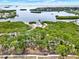 Picturesque aerial shot featuring lush green spaces, a playground, and views of the bay at 748 Soundview Dr, Palm Harbor, FL 34683