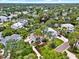 An aerial view of a beautiful waterfront home surrounded by lush landscaping and a sparkling pool offers luxurious living at 748 Soundview Dr, Palm Harbor, FL 34683