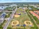A beautiful baseball field, set amongst a local neighborhood close to the water in an aerial view at 748 Soundview Dr, Palm Harbor, FL 34683