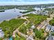 Stunning aerial shot showcasing the coastal neighborhood with bay views and lush landscaping at 748 Soundview Dr, Palm Harbor, FL 34683