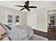 Bedroom with a ceiling fan and access to a private balcony, closet and connected room at 748 Soundview Dr, Palm Harbor, FL 34683