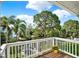 Deck overlooking well maintained landscaping, a small lake, and plenty of shade trees at 748 Soundview Dr, Palm Harbor, FL 34683