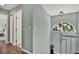 Bright hallway area with an arched window providing natural light and offering a pleasant transition space at 748 Soundview Dr, Palm Harbor, FL 34683