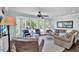 Bright living room with bay windows and elegant decor that provides a relaxing and inviting atmosphere at 748 Soundview Dr, Palm Harbor, FL 34683