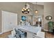 Bright home office with high ceilings, ample natural light and a functional workspace for productivity at 748 Soundview Dr, Palm Harbor, FL 34683