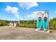 Two paddleboards with lifejackets ready for use on a waterfront with a dock and charming neighborhood at 748 Soundview Dr, Palm Harbor, FL 34683