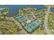 Aerial view of clubhouse, pool, and landscaping at 8016 Bounty Ln, Bradenton, FL 34202
